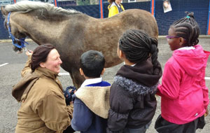 School children with horse